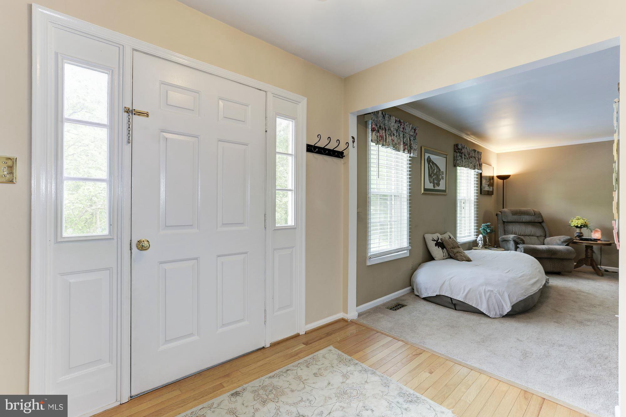Enter into the spacious front hall