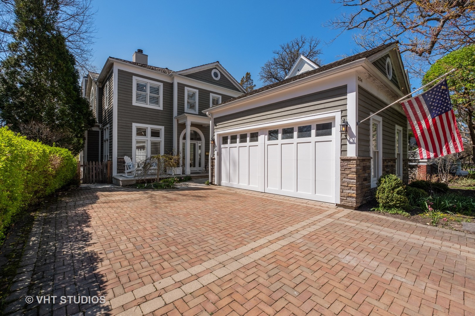 254 Ridge Avenue Winnetka, IL 60093 - Photo 2 of 34 a front view of a house with a yard