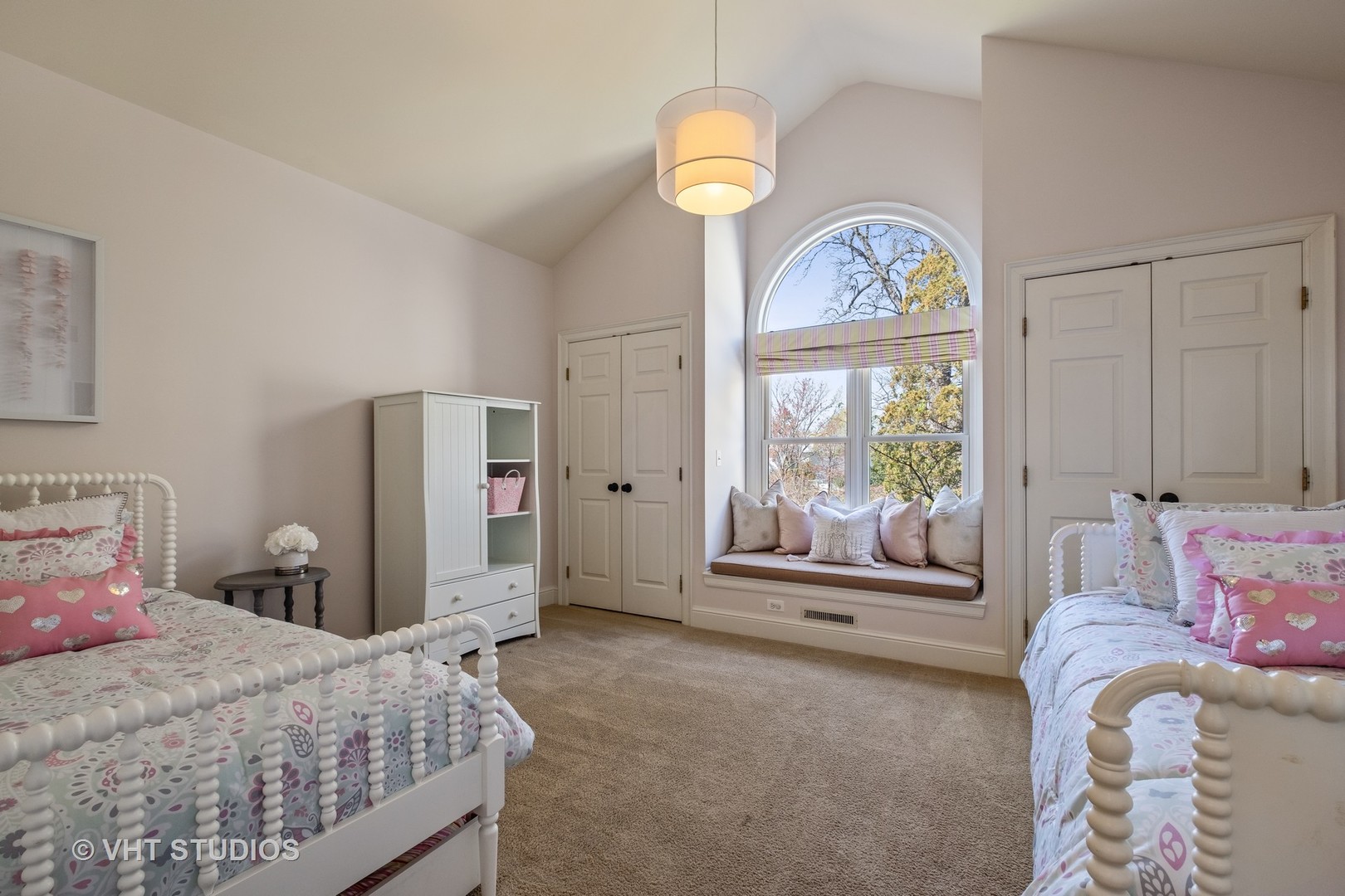 254 Ridge Avenue Winnetka, IL 60093 - Photo 22 of 34 a bedroom with a bed and a chandelier