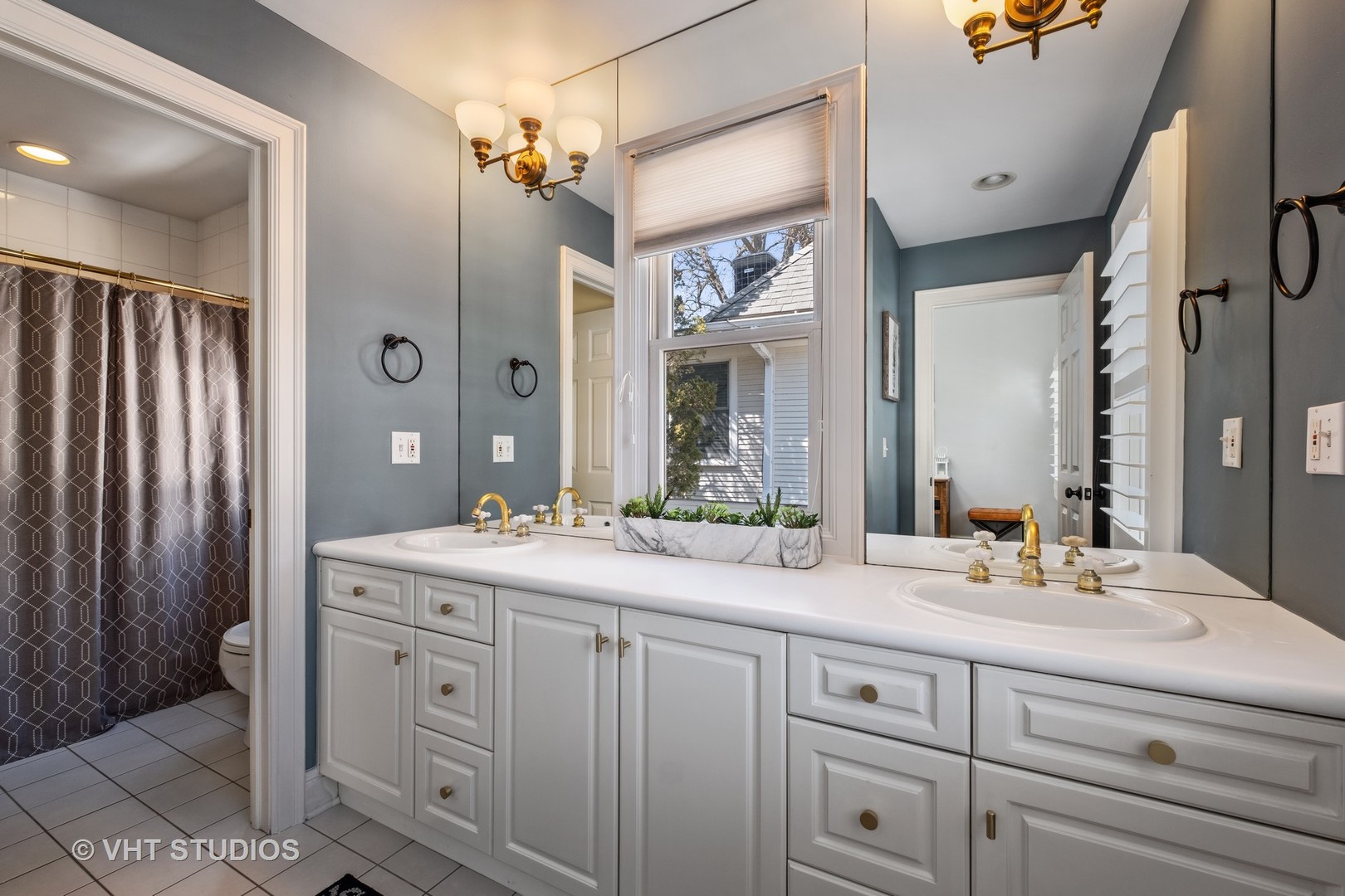 254 Ridge Avenue Winnetka, IL 60093 - Photo 25 of 34 a bathroom with a double vanity sink mirror and double