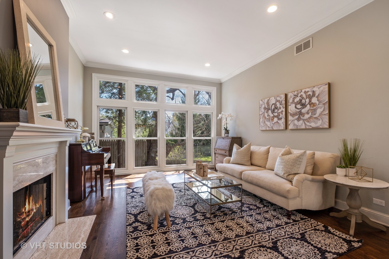 254 Ridge Avenue Winnetka, IL 60093 - Photo 5 of 34 a living room with furniture a fireplace and a flat screen tv