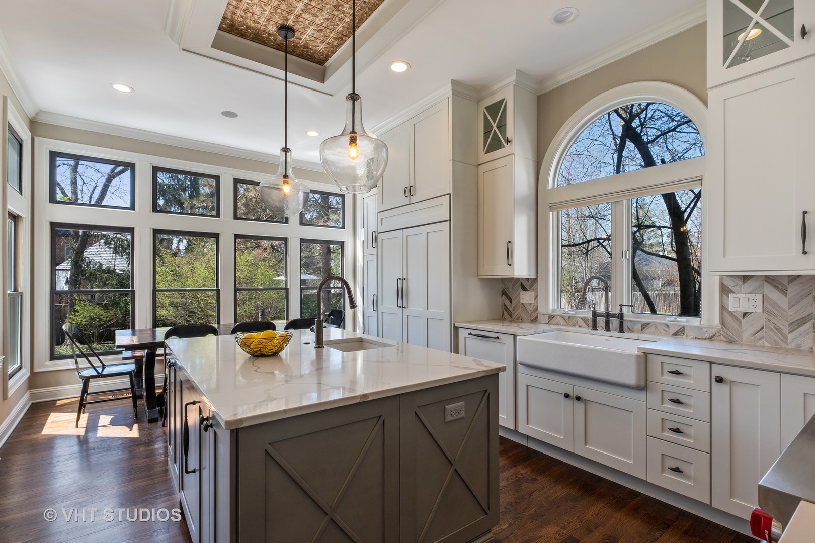 254 Ridge Avenue Winnetka, IL 60093 - Photo 10 of 34 a kitchen with a sink a counter space dining table and chairs