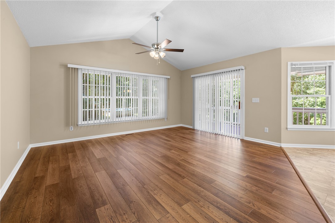 429 Burns Mill Road West Union, SC 29696 - Photo 8 of 49 Hardwood flooring extends throughout this naturally illuminated living space with a vaulted ceiling.