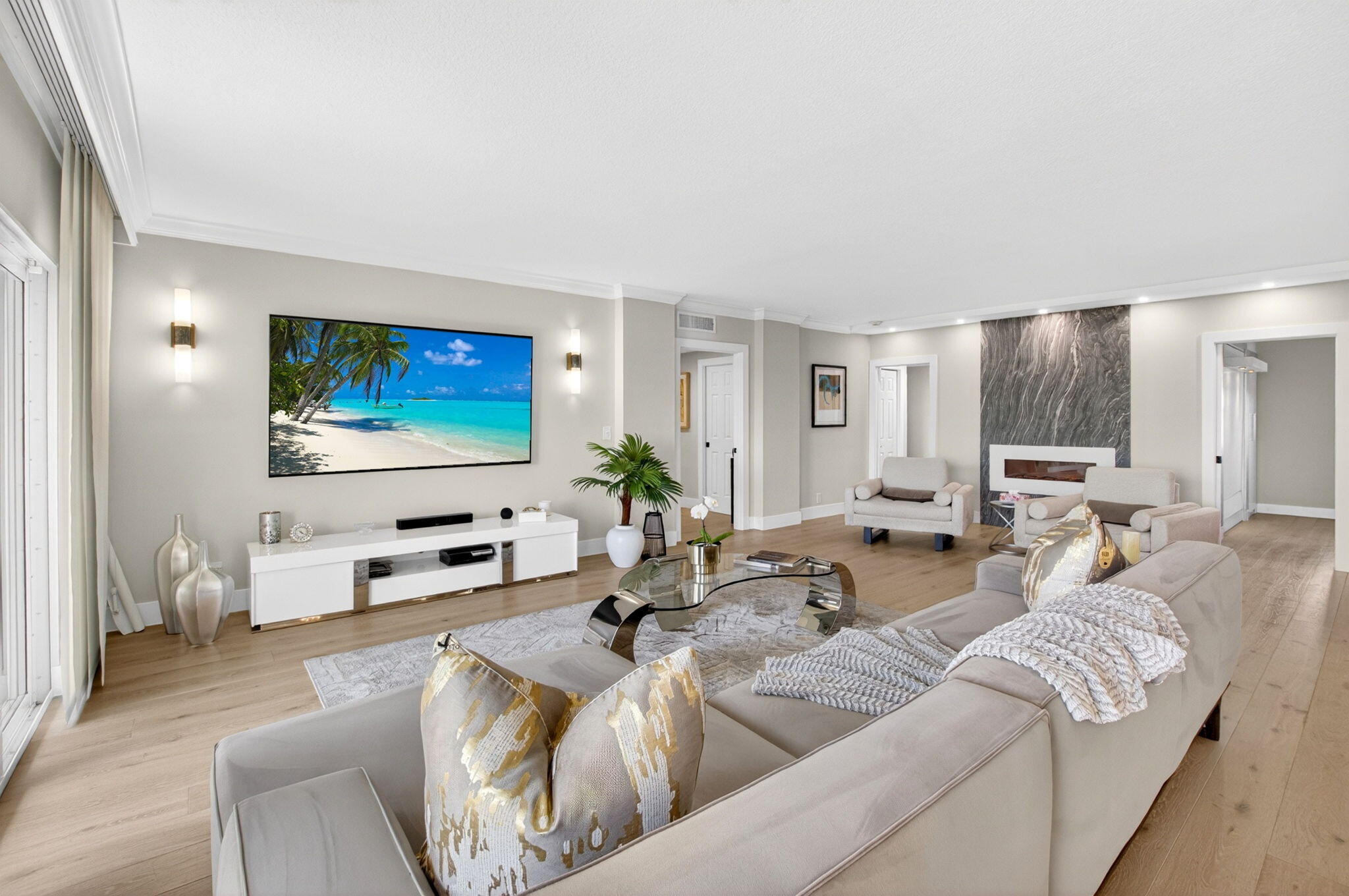 950 De Soto Road, Unit 5A Boca Raton, FL 33432 - Photo 18 of 98 a living room with furniture and a flat screen tv