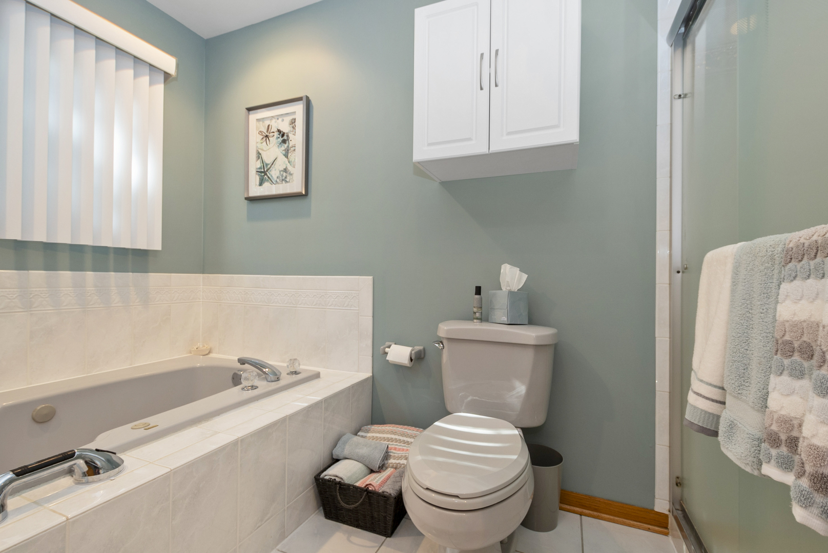 9051 Archer Avenue Willow Springs, IL 60480 - Photo 21 of 30 a bathroom with a sink and a toilet