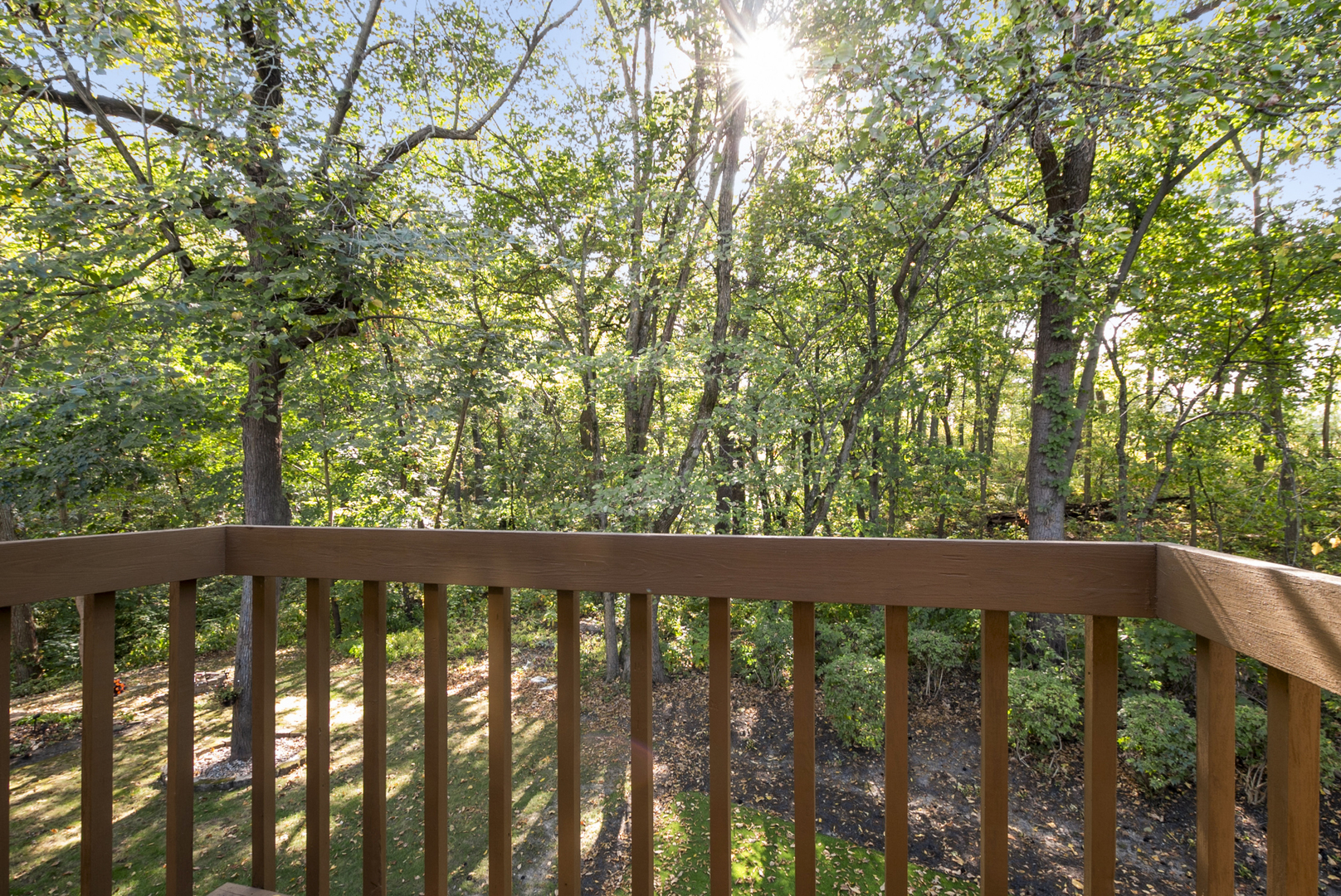 9051 Archer Avenue Willow Springs, IL 60480 - Photo 23 of 30 a wooden fence with trees in the background
