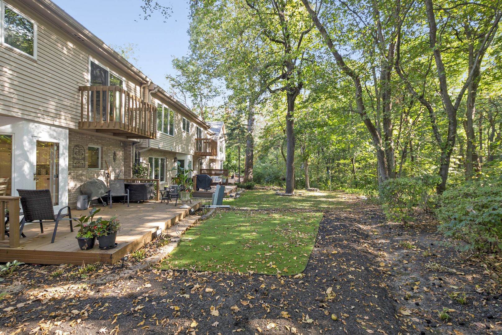 9051 Archer Avenue Willow Springs, IL 60480 - Photo 29 of 30 a view of a patio with table and chairs under an umbrella