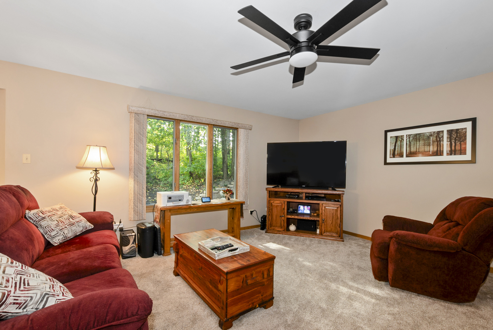 9051 Archer Avenue Willow Springs, IL 60480 - Photo 9 of 30 a living room with furniture and a flat screen tv