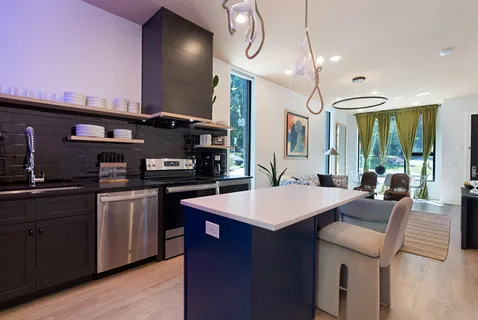 a living room with furniture and a chandelier