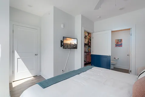 a bathroom with a sink vanity and toilet