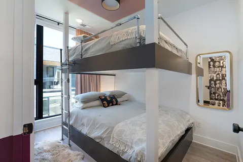 a bathroom with a sink mirror vanity and toilet