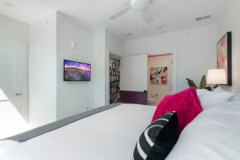 a bathroom with a sink a toilet and mirror