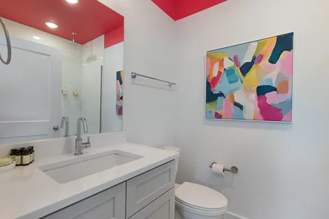 a bedroom with furniture and a large window