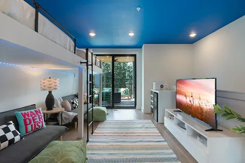 a bathroom with a sink a vanity and a mirror
