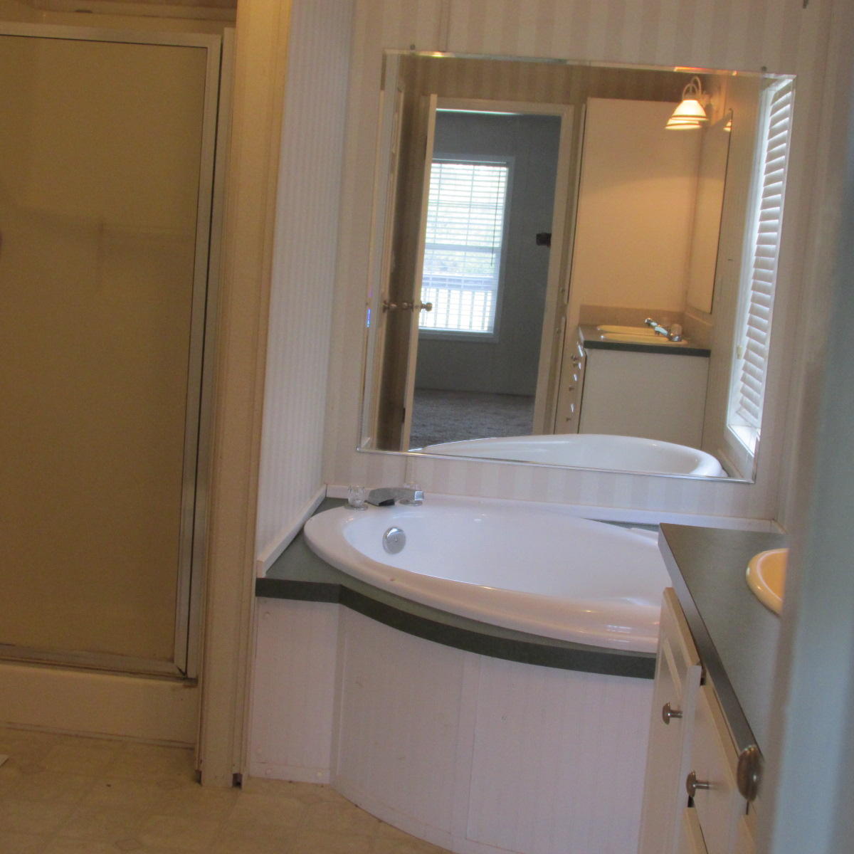 2643 Rutrough Road Southeast Roanoke, VA 24014 - Photo 14 of 32 a bathroom with a sink and a mirror