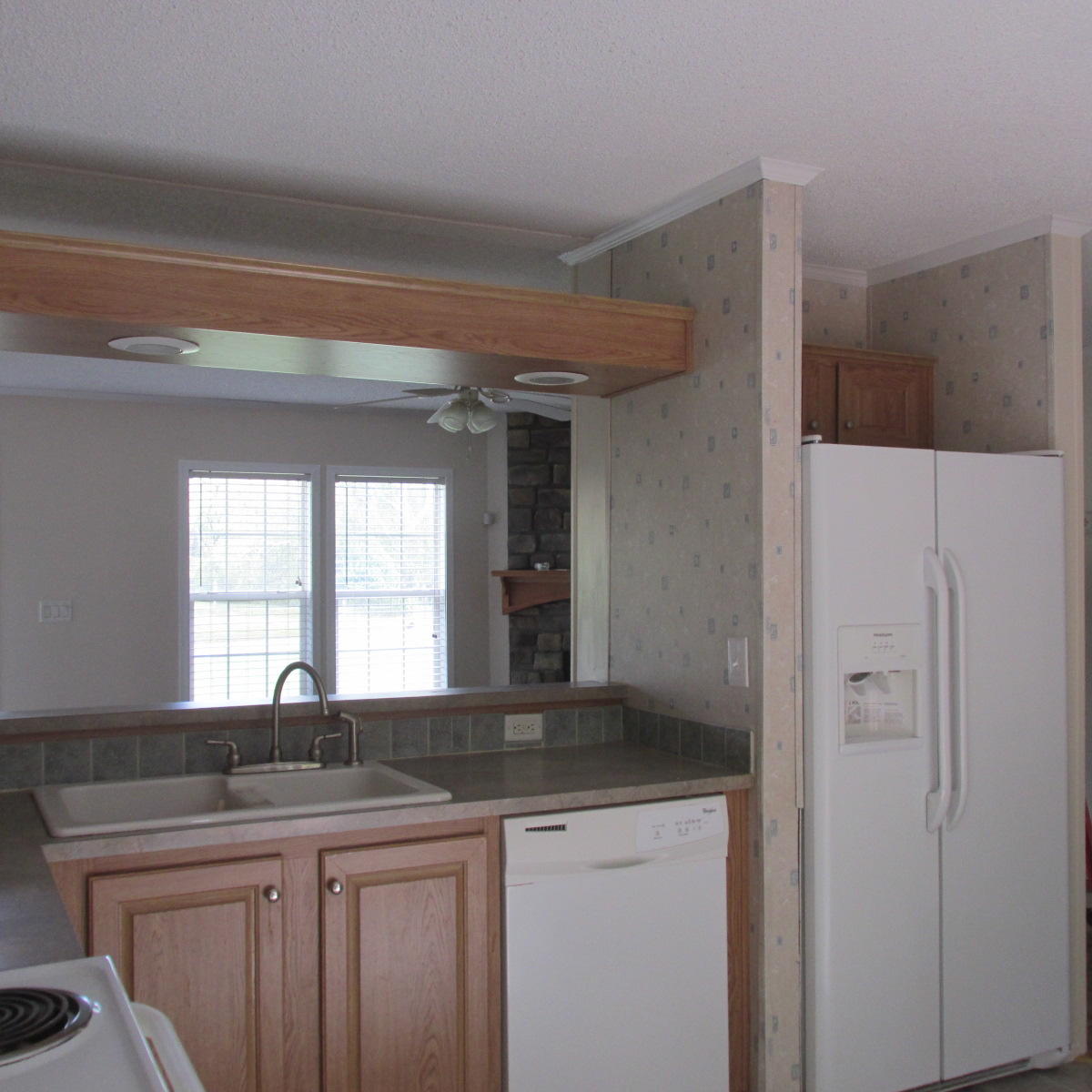 2643 Rutrough Road Southeast Roanoke, VA 24014 - Photo 17 of 32 a kitchen with a sink and a mirror