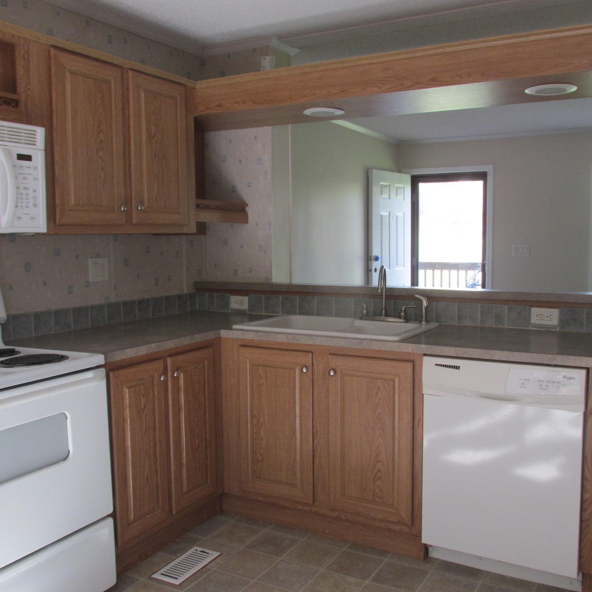 2643 Rutrough Road Southeast Roanoke, VA 24014 - Photo 18 of 32 a kitchen with granite countertop white cabinets and white appliances