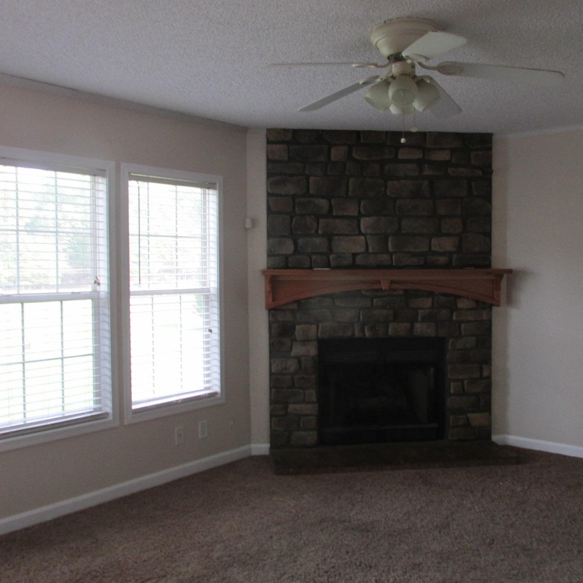 2643 Rutrough Road Southeast Roanoke, VA 24014 - Photo 10 of 32 a living room with a fireplace in it and a fireplace