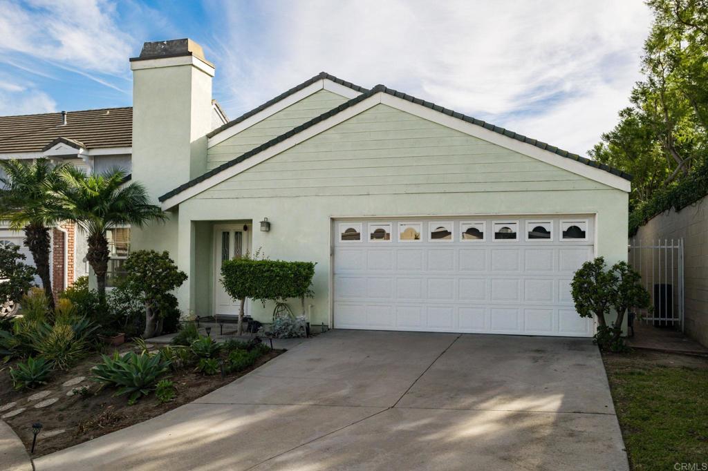 front view of a house with potted plants