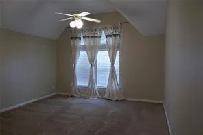 an empty room with water heater painted walls