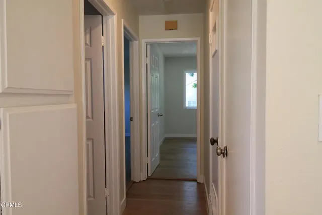 a view of a bathroom from a hallway