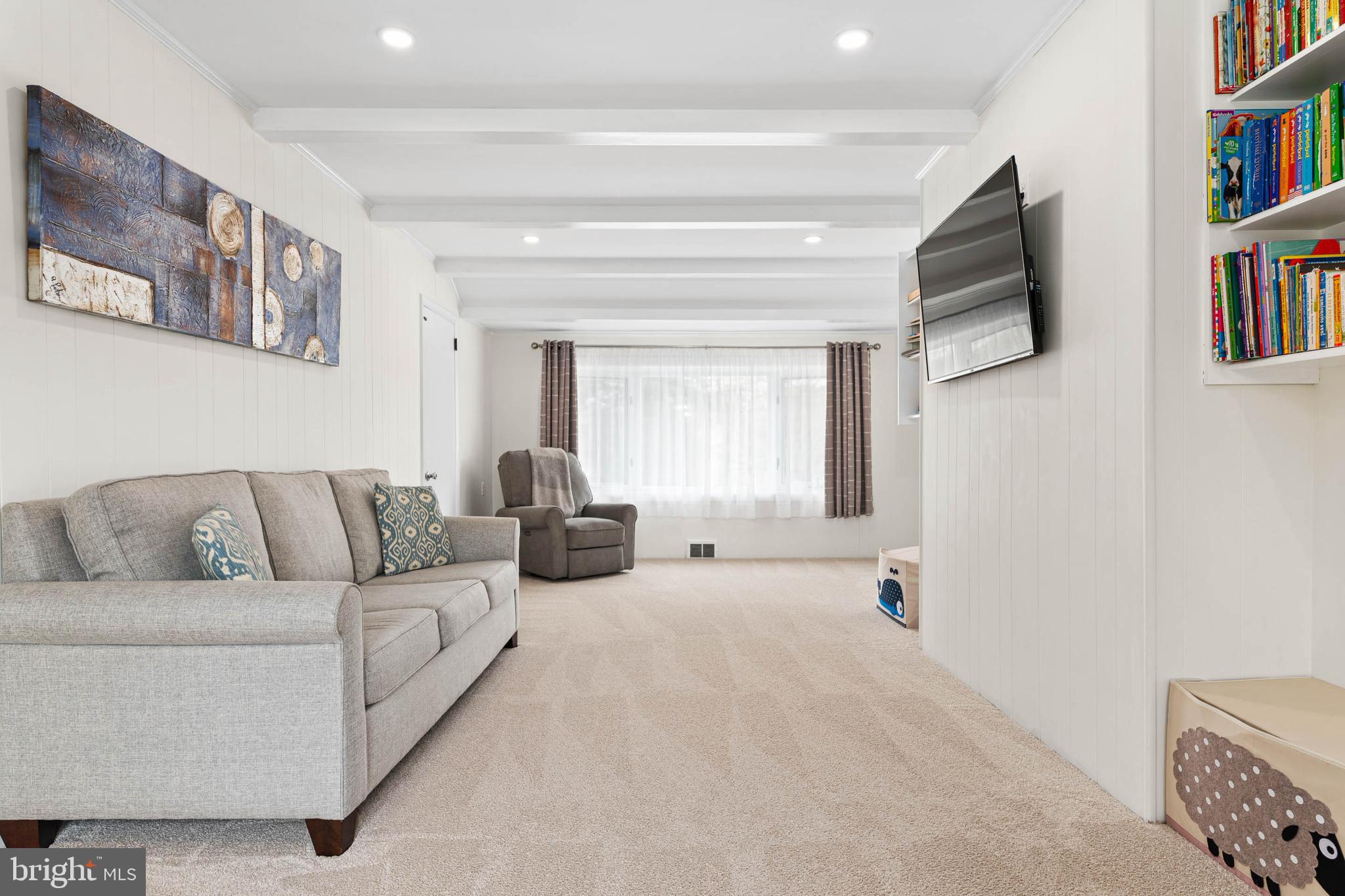 136 Ashley Road Newtown Square, PA 19073 - Photo 11 of 29 a living room with furniture and a book shelf