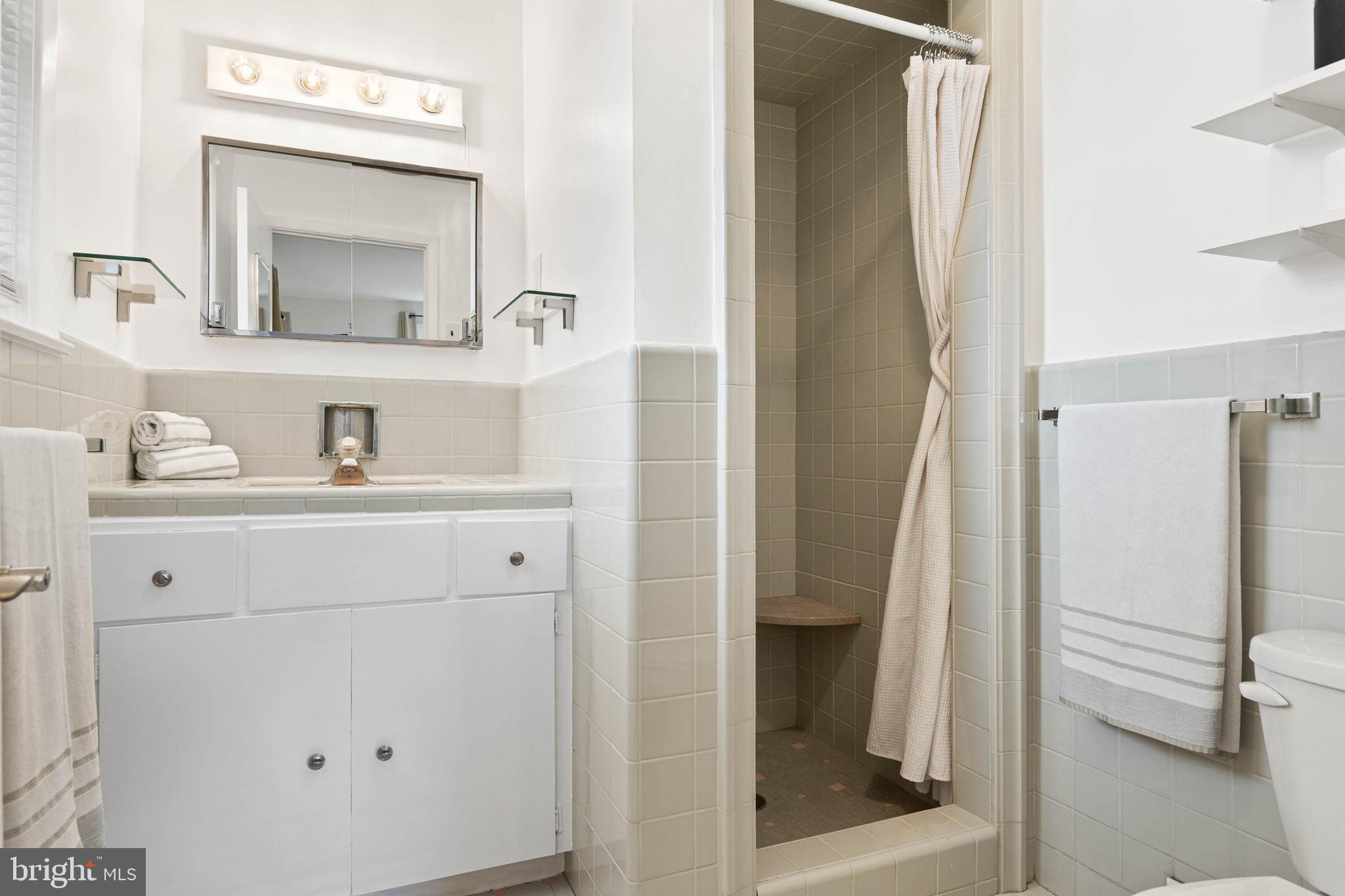 136 Ashley Road Newtown Square, PA 19073 - Photo 18 of 29 a bathroom with a sink and a mirror with toilet