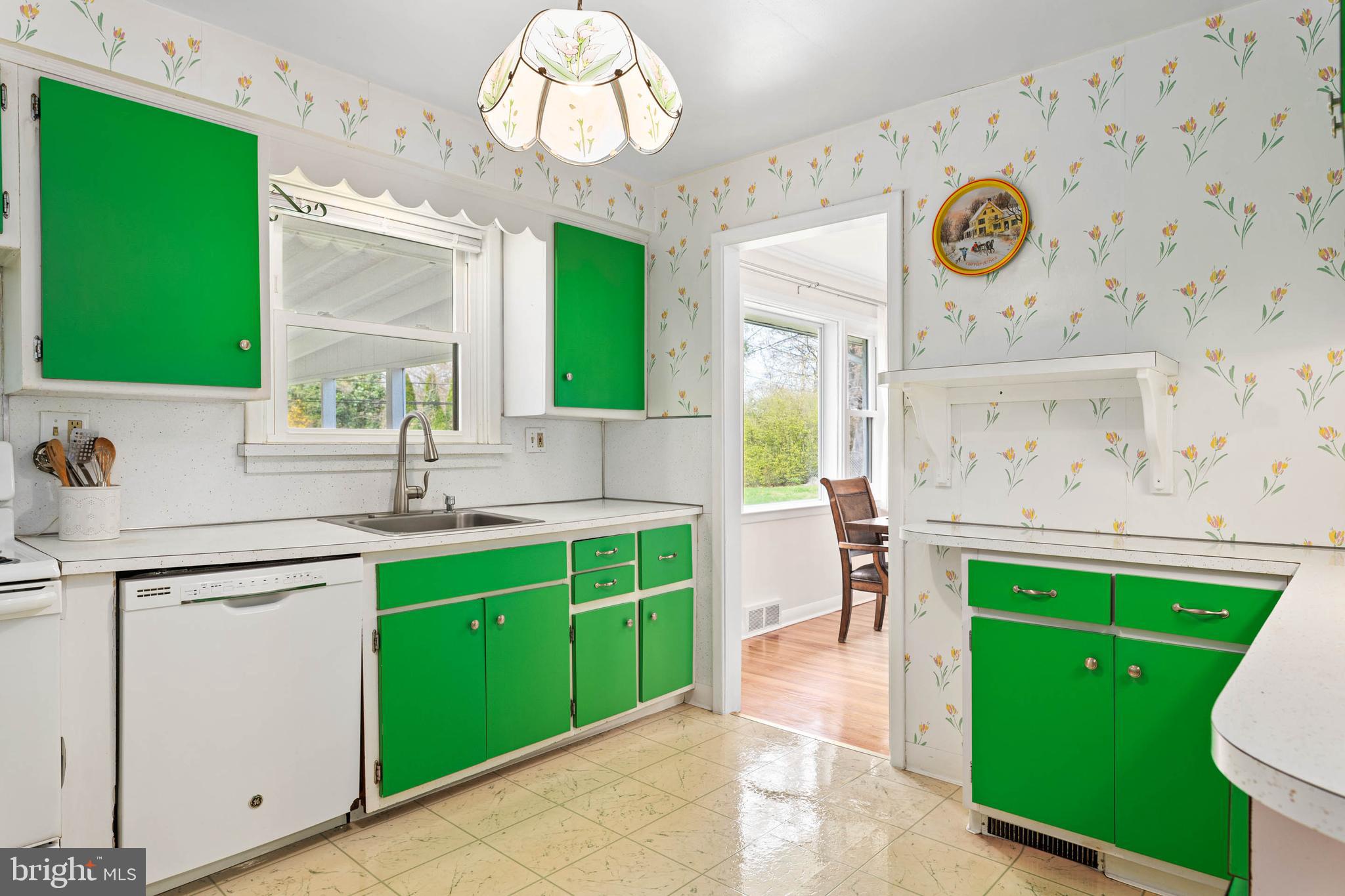 136 Ashley Road Newtown Square, PA 19073 - Photo 9 of 29 a kitchen with a sink cabinets and a large window