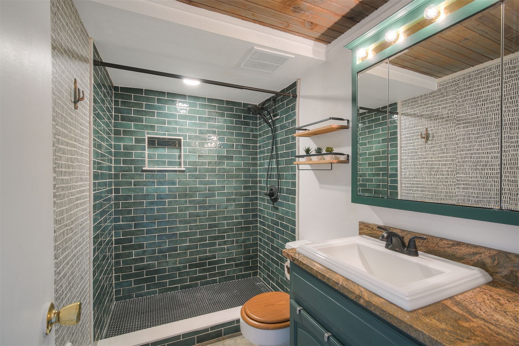 7031 Ryan Gulch Road, Unit 301 Silverthorne, CO 80498 - Photo 17 of 37 a bathroom with a sink a toilet and shower
