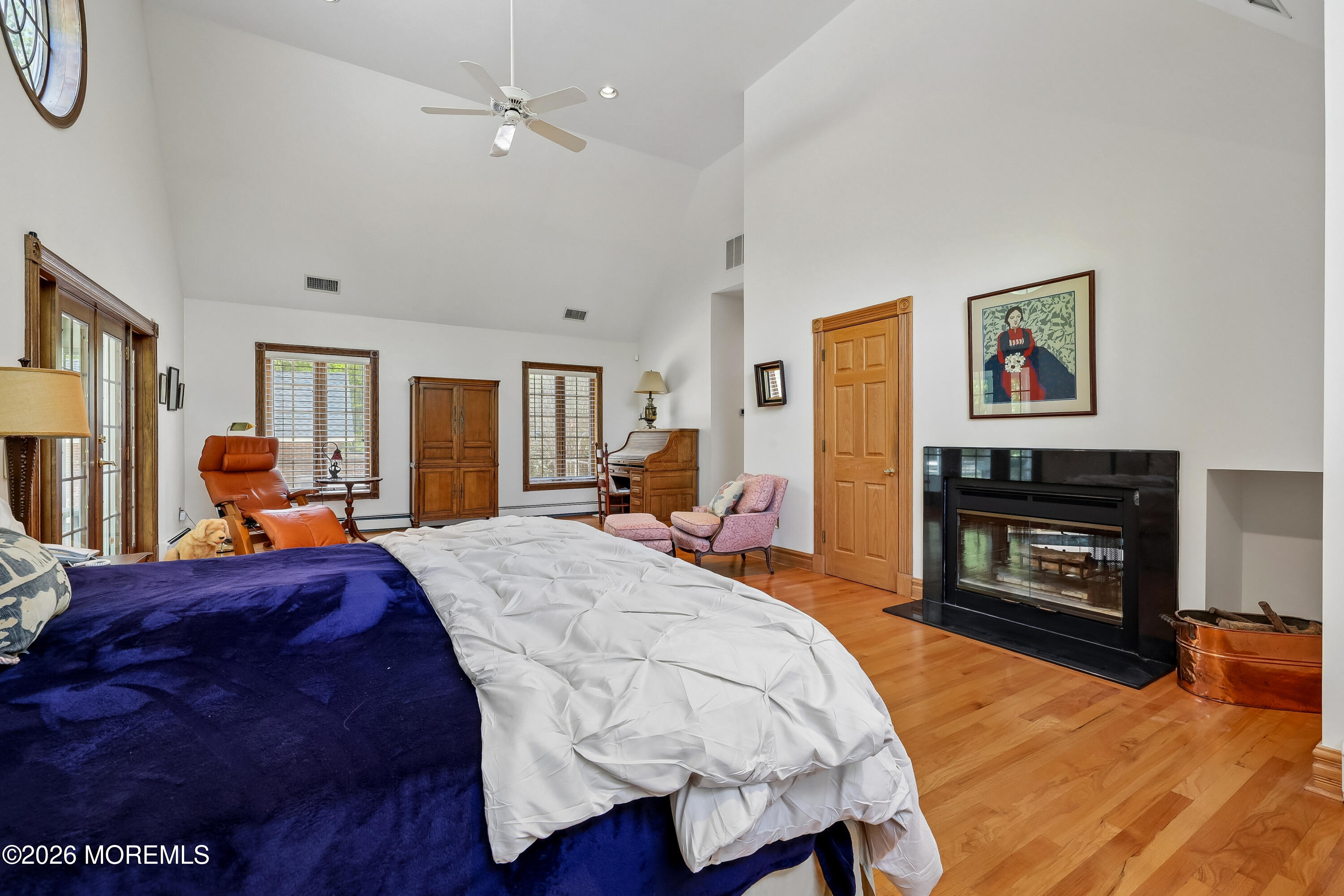 187 Hockhockson Road Colts Neck, NJ 07722 - Photo 29 of 55 a bed room with a bed and a fireplace