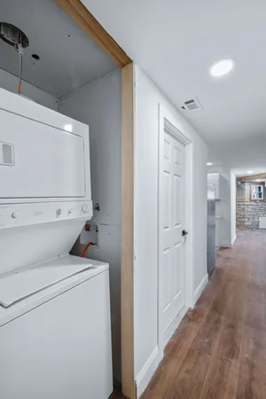 a view of storage and utility room with washer and dryer