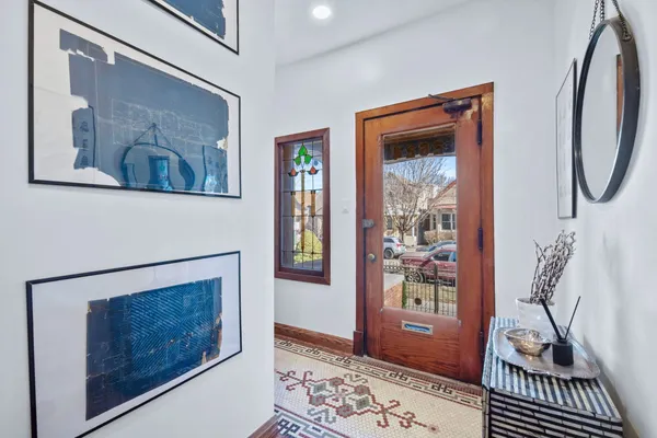 a living room with a wooden floor and a fireplace