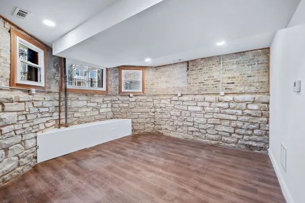 a bathroom with a bathtub and shower