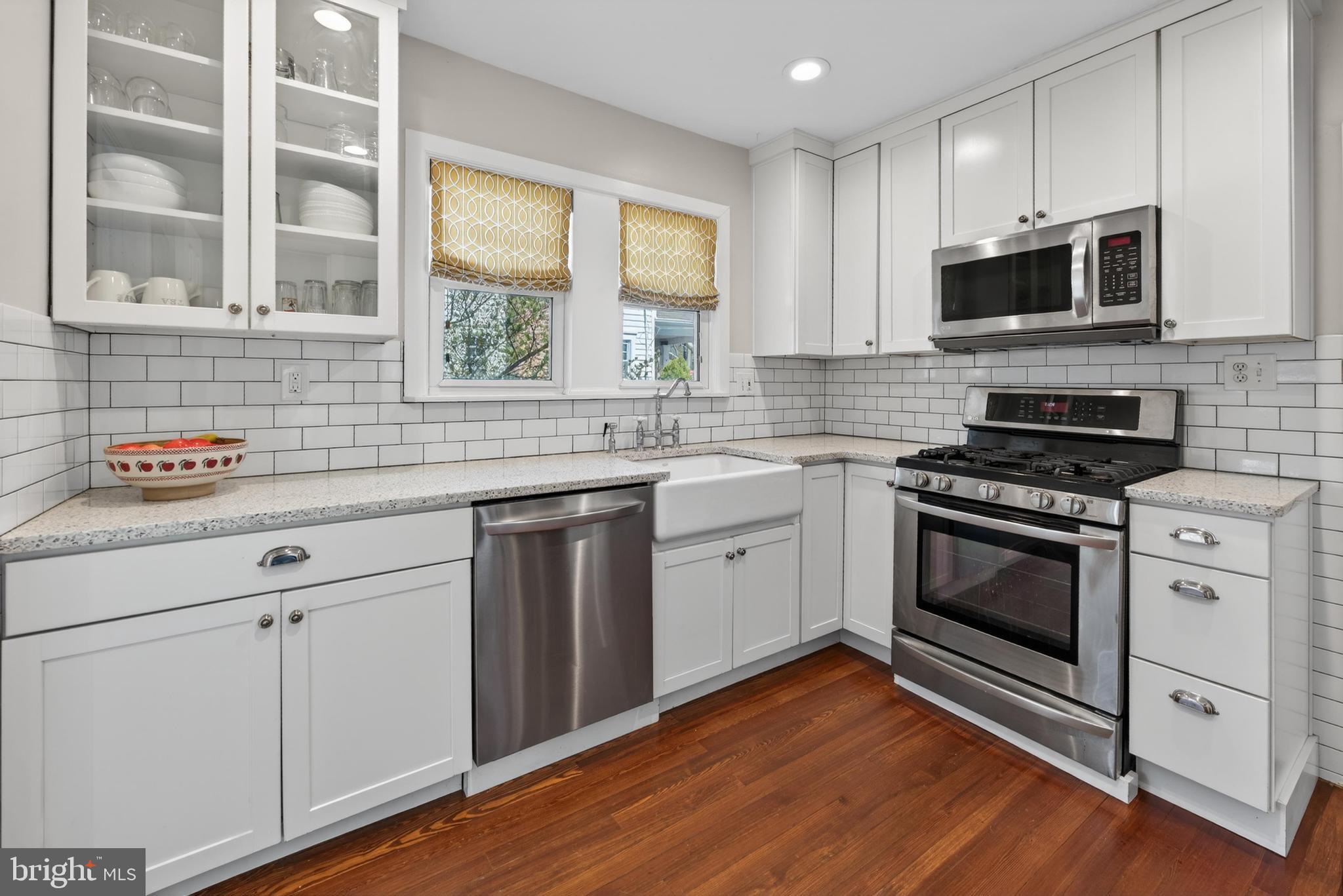 812 Princeton Avenue Haddonfield, NJ 08033 - Photo 15 of 30 a kitchen with granite countertop a sink cabinets stainless steel appliances and a window
