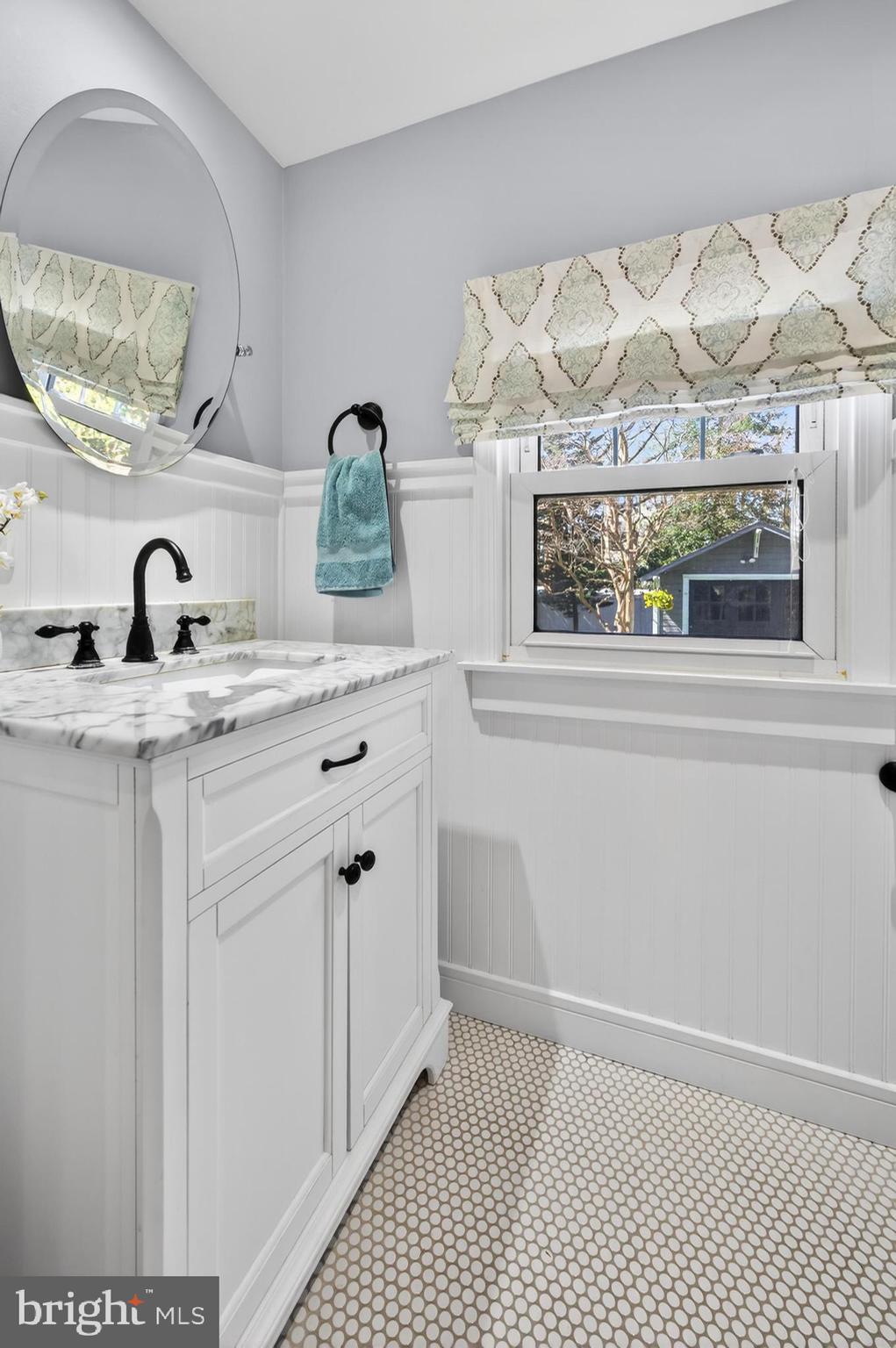 812 Princeton Avenue Haddonfield, NJ 08033 - Photo 16 of 30 a bathroom with a sink and a mirror