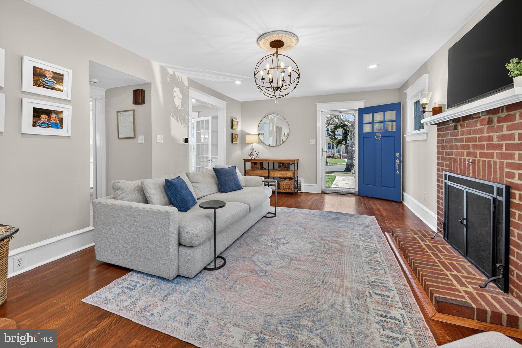 812 Princeton Avenue Haddonfield, NJ 08033 - Photo 5 of 30 a living room with furniture a fireplace and a flat screen tv