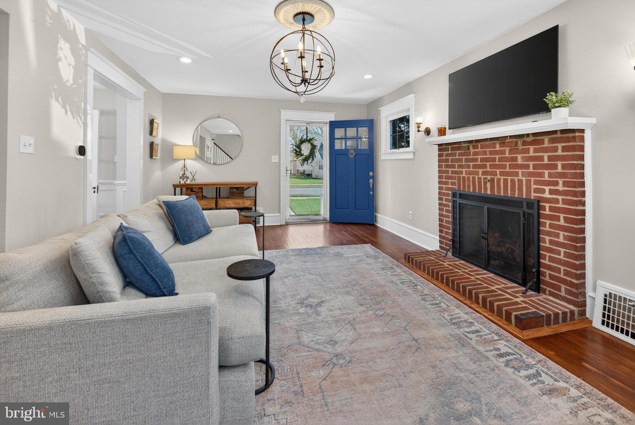 812 Princeton Avenue Haddonfield, NJ 08033 - Photo 6 of 30 a living room with furniture a fireplace and a flat screen tv