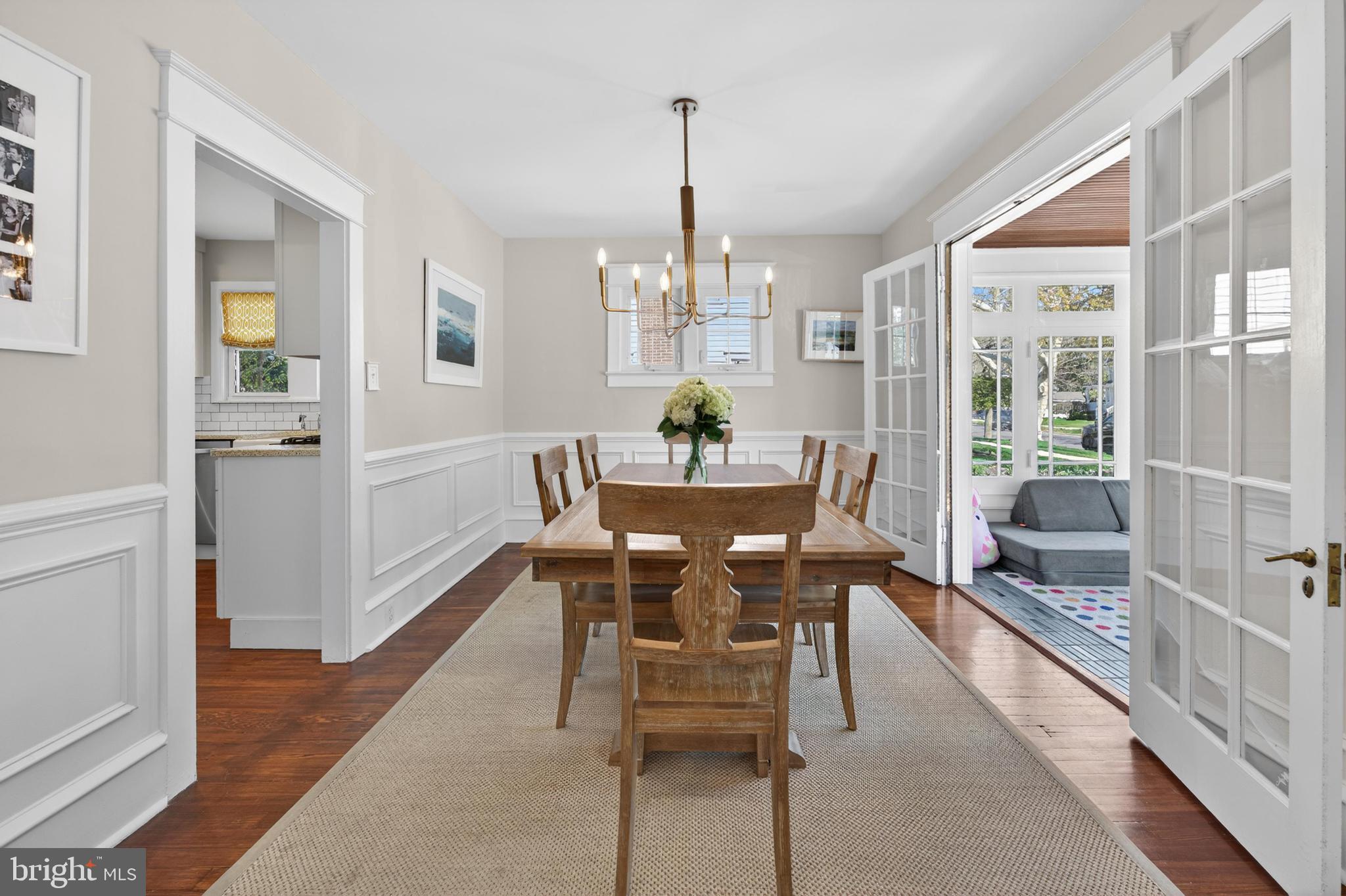 812 Princeton Avenue Haddonfield, NJ 08033 - Photo 7 of 30 a dining room with furniture a chandelier and wooden floor