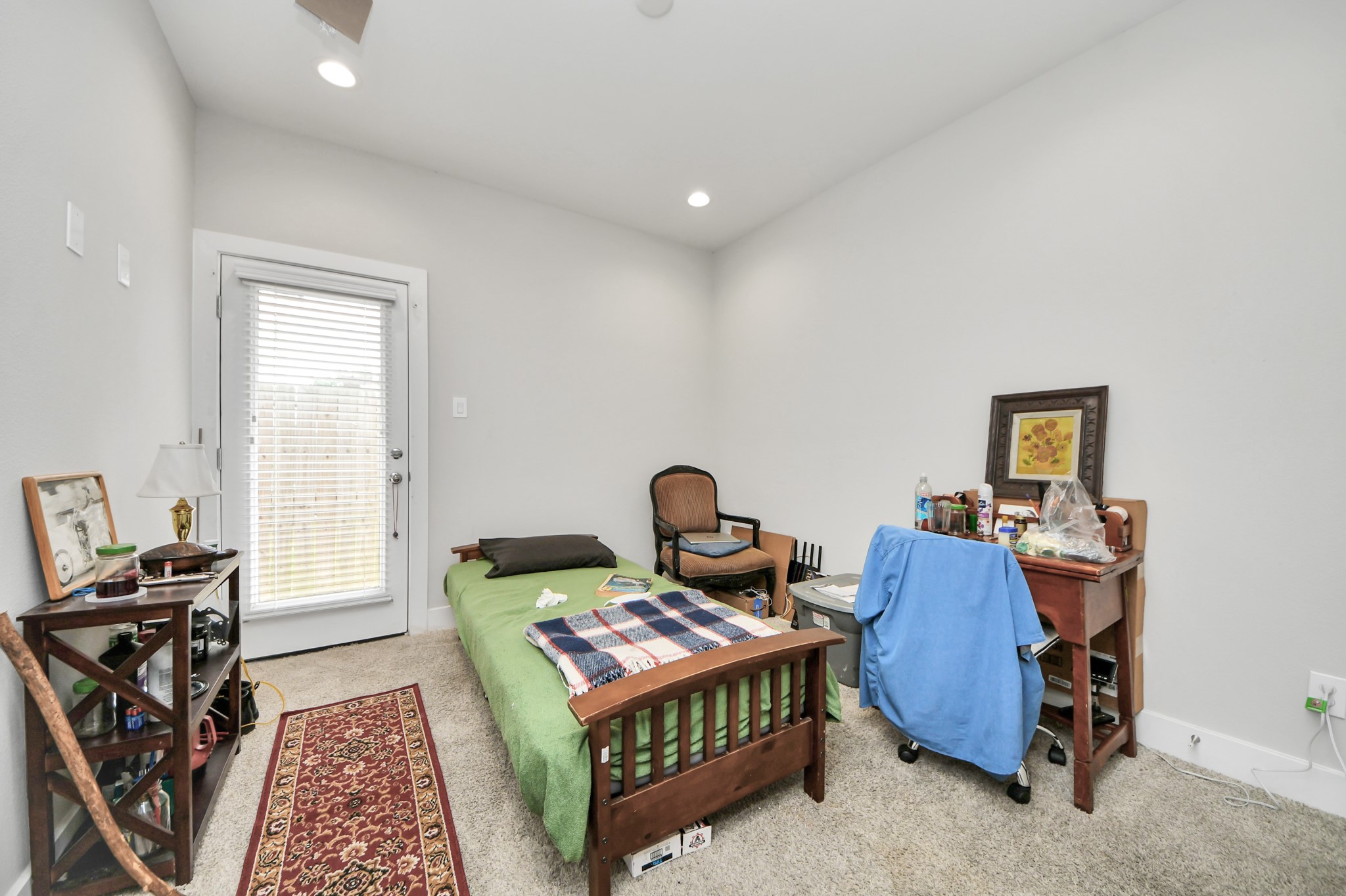 6715 Allegheny Street Houston, TX 77021 - Photo 13 of 18 a view of a workspace with furniture and a window