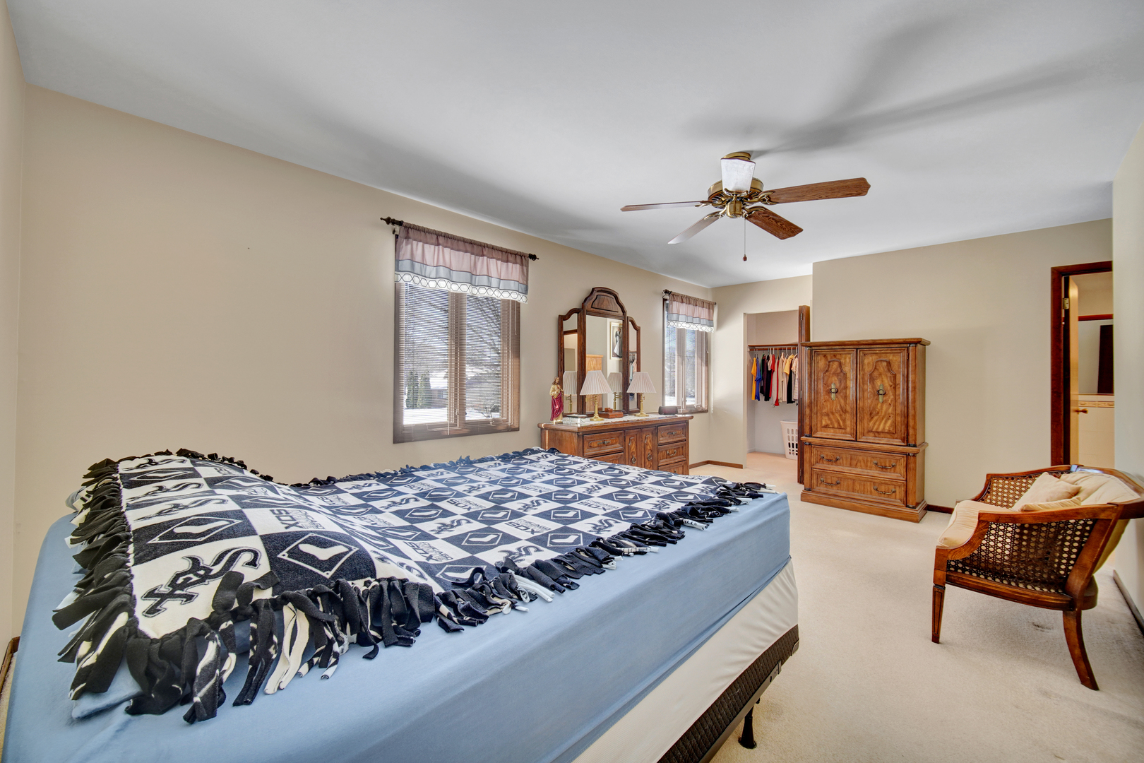 900 St Andrews Way Frankfort, IL 60423 - Photo 13 of 22 a bedroom with a bed and dresser with mirror