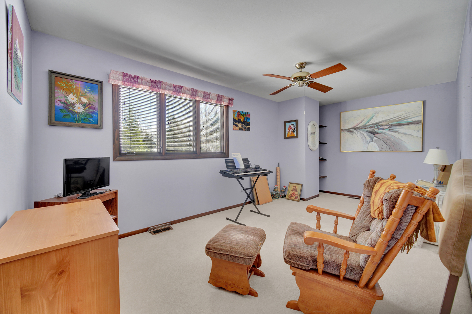 900 St Andrews Way Frankfort, IL 60423 - Photo 17 of 22 a work room with furniture a flat screen tv and a window