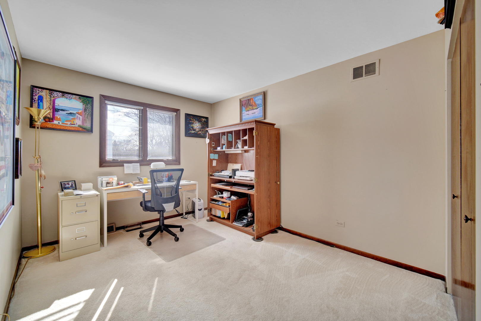 900 St Andrews Way Frankfort, IL 60423 - Photo 19 of 22 a view of a workspace with furniture and a window