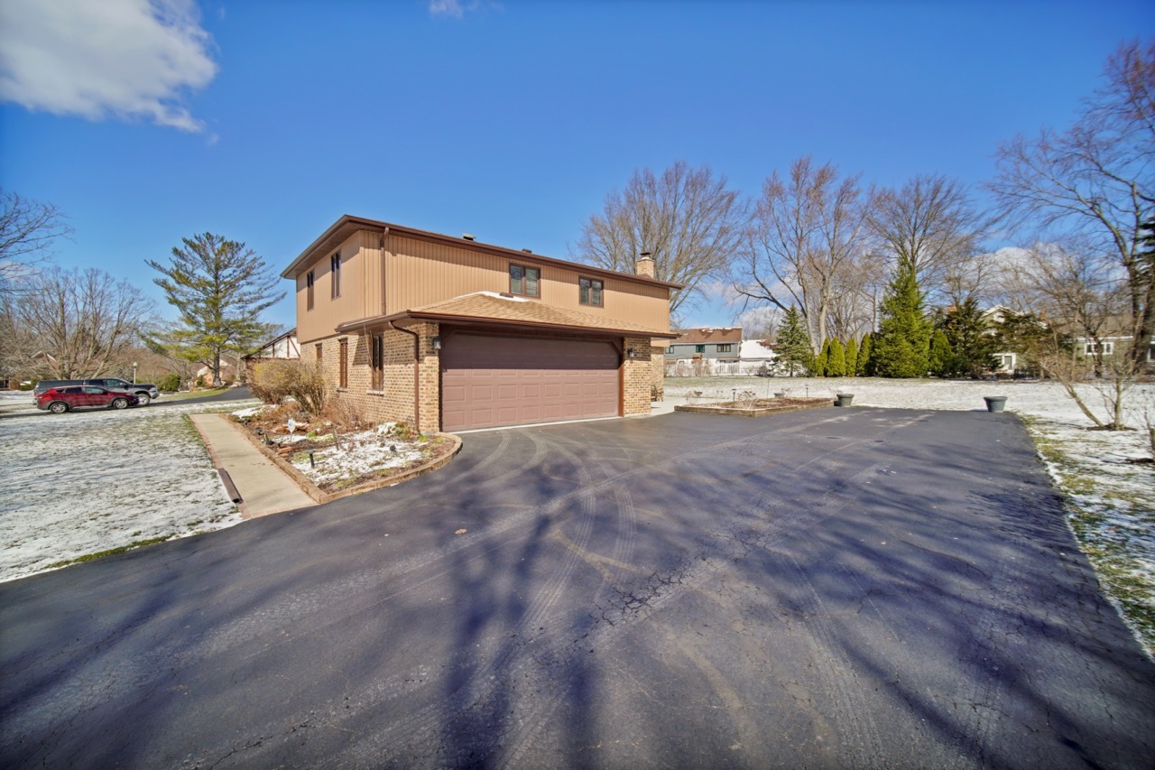 900 St Andrews Way Frankfort, IL 60423 - Photo 22 of 22 a front view of a house with a yard