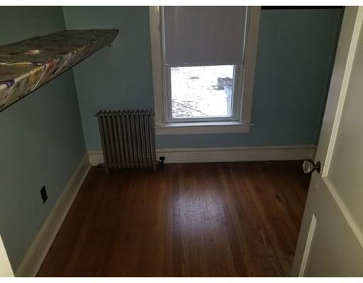 475 Reed Road Dartmouth, MA 02747 - Photo 13 of 21 a view of an empty room with wooden floor and a window