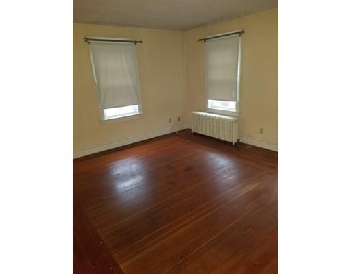475 Reed Road Dartmouth, MA 02747 - Photo 8 of 21 a view of an empty room with a window and wooden floor