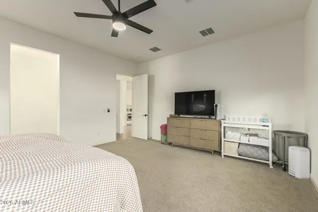 a bathroom with a double vanity sink toilet mirror and