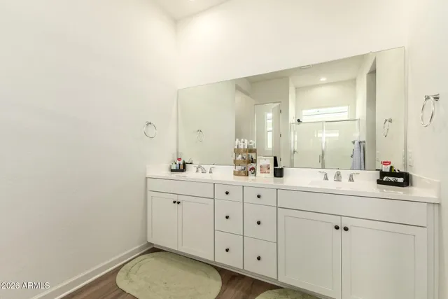 a bathroom with a glass shower door