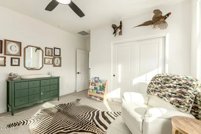 a bed room with a bed and a desk