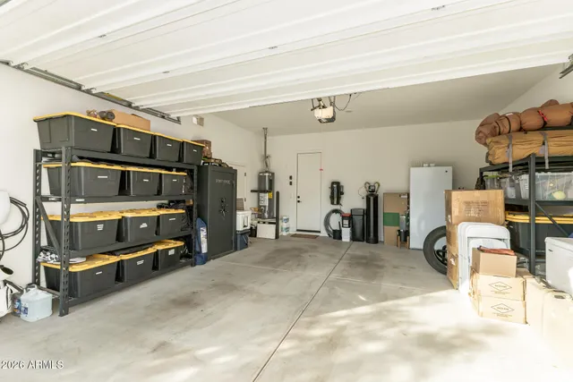 a view of a livingroom with furniture and floor to ceiling window
