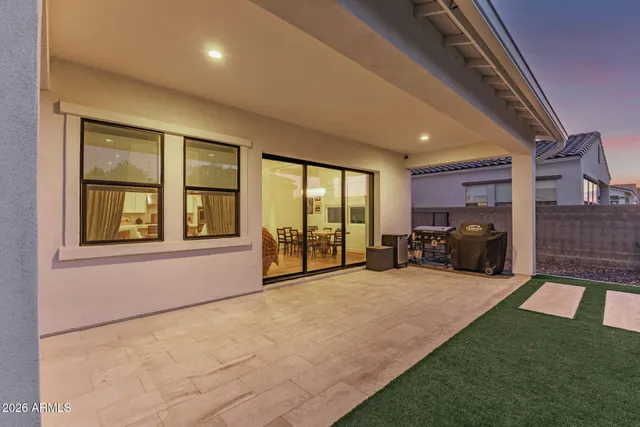 a balcony with table and chairs